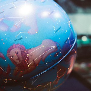 Globe with zodiac constellations, symbolising Vedic astrology specialist services