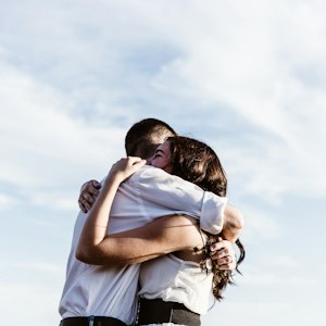 Couple embracing in reunion, symbolising getting lost love back through astrology remedies