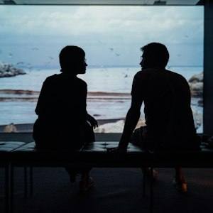 Silhouetted couple talking, symbolising relationship problem astrology guidance